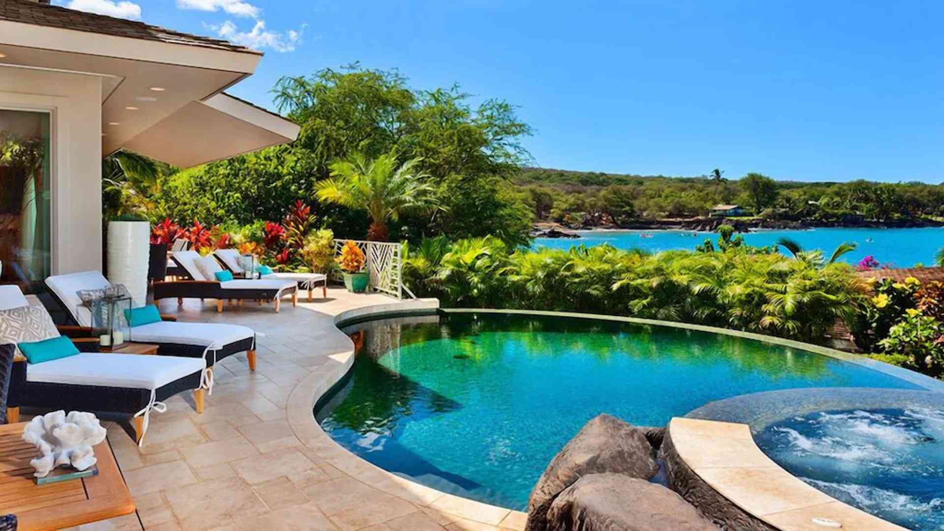 Makena garden pool surrounded by layered tropical landscaping